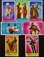 Набор почтовых марок (7 шт.). "Африканцы, играющие на местных инструментах". 1967 год, Либерия.